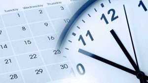 Calendar and clock representing scheduling, time management, or deadline planning