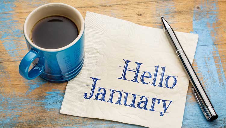 Hello January with a cup of coffee on desk