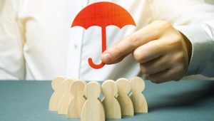An image of an umbrella covering people much like a life insurance policy.