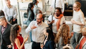 Charity event - group of donors exchanging conversation while having wine