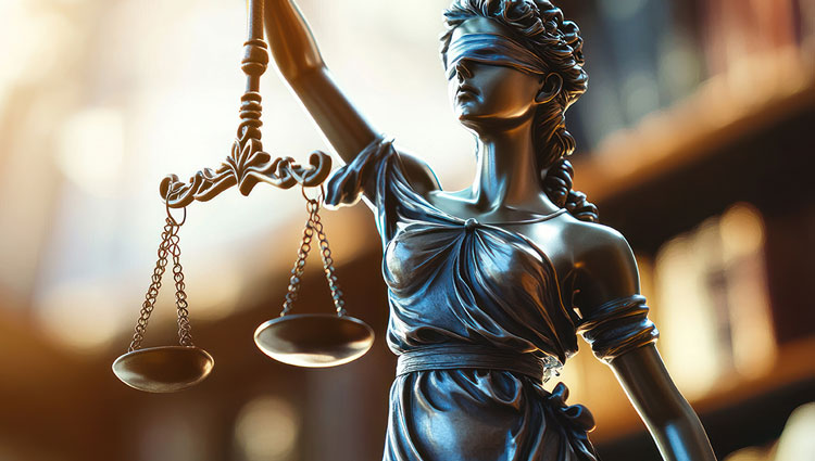 Statue of Lady Justice holding scales and wearing a blindfold, symbolizing fairness and the importance of legal planning such as creating a will.